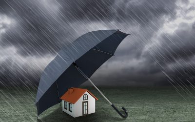 umbrella covering home under heavy rain, insurance concept